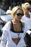 LindsayLohan.us 209102b1a566cd537093ceeb5b3a6d4a Lindsay Lohan   wearing a sports bra at a Coffee Bean & Tea Leaf in LA 07/09/10 Lindsay Lohan Pictures and videos