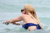 LindsayLohan.us 35ae08329764d1dc7bb09f7df995c422 Lindsay Lohan   In Bikini on Miami Beach BOOB Slip   May 23,2011 Lindsay Lohan Pictures and videos