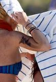 LindsayLohan.us 50e6c82d53d288af03042719db4189be Lindsay Lohan   In Bikini on Miami Beach BOOB Slip   May 23,2011 Lindsay Lohan Pictures and videos