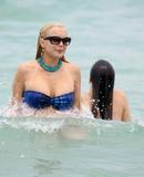 LindsayLohan.us 755828b60eec2a9b6415fcf05347b2ac Lindsay Lohan   In Bikini on Miami Beach BOOB Slip   May 23,2011 Lindsay Lohan Pictures and videos