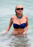 LindsayLohan.us 859439522eb4fcdab72ec15762911af9 Lindsay Lohan   In Bikini on Miami Beach BOOB Slip   May 23,2011 Lindsay Lohan Pictures and videos