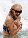 LindsayLohan.us 85fdc0f357a9107f2670d1808914057e Lindsay Lohan   In Bikini on Miami Beach BOOB Slip   May 23,2011 Lindsay Lohan Pictures and videos