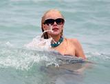 LindsayLohan.us 92fc3e0a5c5ce633977aa40ef1d94857 Lindsay Lohan   In Bikini on Miami Beach BOOB Slip   May 23,2011 Lindsay Lohan Pictures and videos
