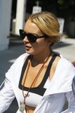 LindsayLohan.us a768506c6b5f5d8d5ebda10695dde62c Lindsay Lohan   wearing a sports bra at a Coffee Bean & Tea Leaf in LA 07/09/10 Lindsay Lohan Pictures and videos