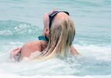 LindsayLohan.us ad499cea7bac7bf34eff5d98cbeea376 Lindsay Lohan   In Bikini on Miami Beach BOOB Slip   May 23,2011 Lindsay Lohan Pictures and videos