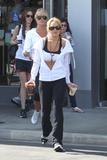 LindsayLohan.us c665f7e883959522823afd2fb85f26fc Lindsay Lohan   wearing a sports bra at a Coffee Bean & Tea Leaf in LA 07/09/10 Lindsay Lohan Pictures and videos