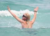 LindsayLohan.us d4a228d13a2bc6546852451b0311d304 Lindsay Lohan   In Bikini on Miami Beach BOOB Slip   May 23,2011 Lindsay Lohan Pictures and videos