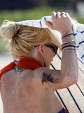 LindsayLohan.us eac3d1a79f24ce94faf5ab80ac79bdce Lindsay Lohan   In Bikini on Miami Beach BOOB Slip   May 23,2011 Lindsay Lohan Pictures and videos